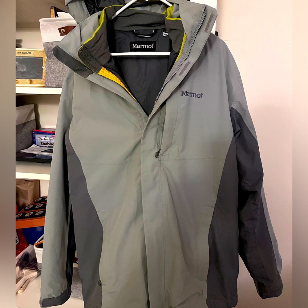 Gray Marmot jacket with removable shell and hood. Waterproof.